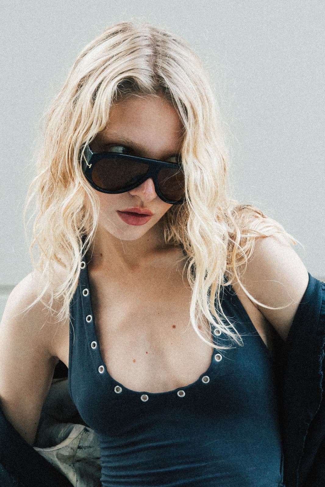 Close portrait of a blonde model in dark sunglasses and a teal swimsuit — NIKA, by Kenneth Kemp